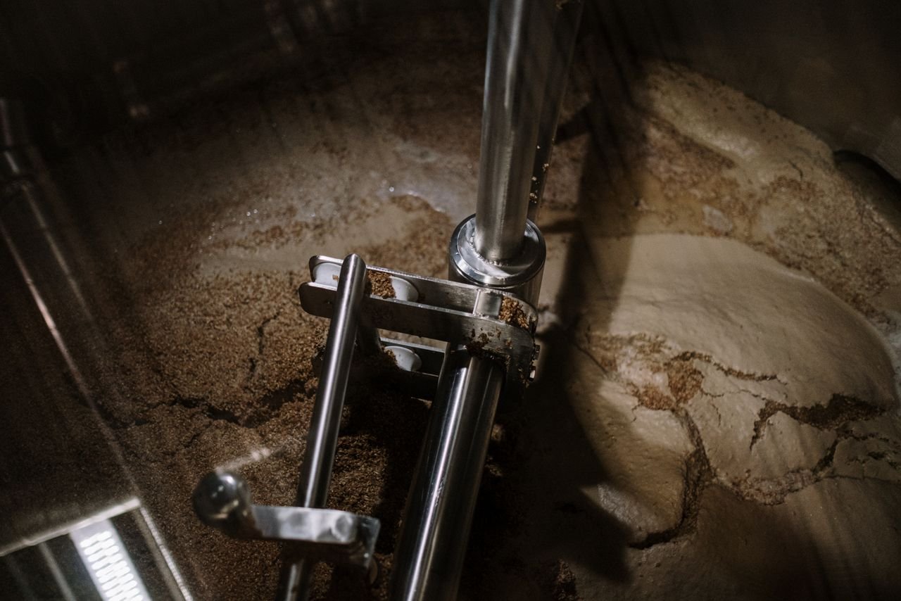 Industrial fermentation mixer in a brewery tank, showing active mixing